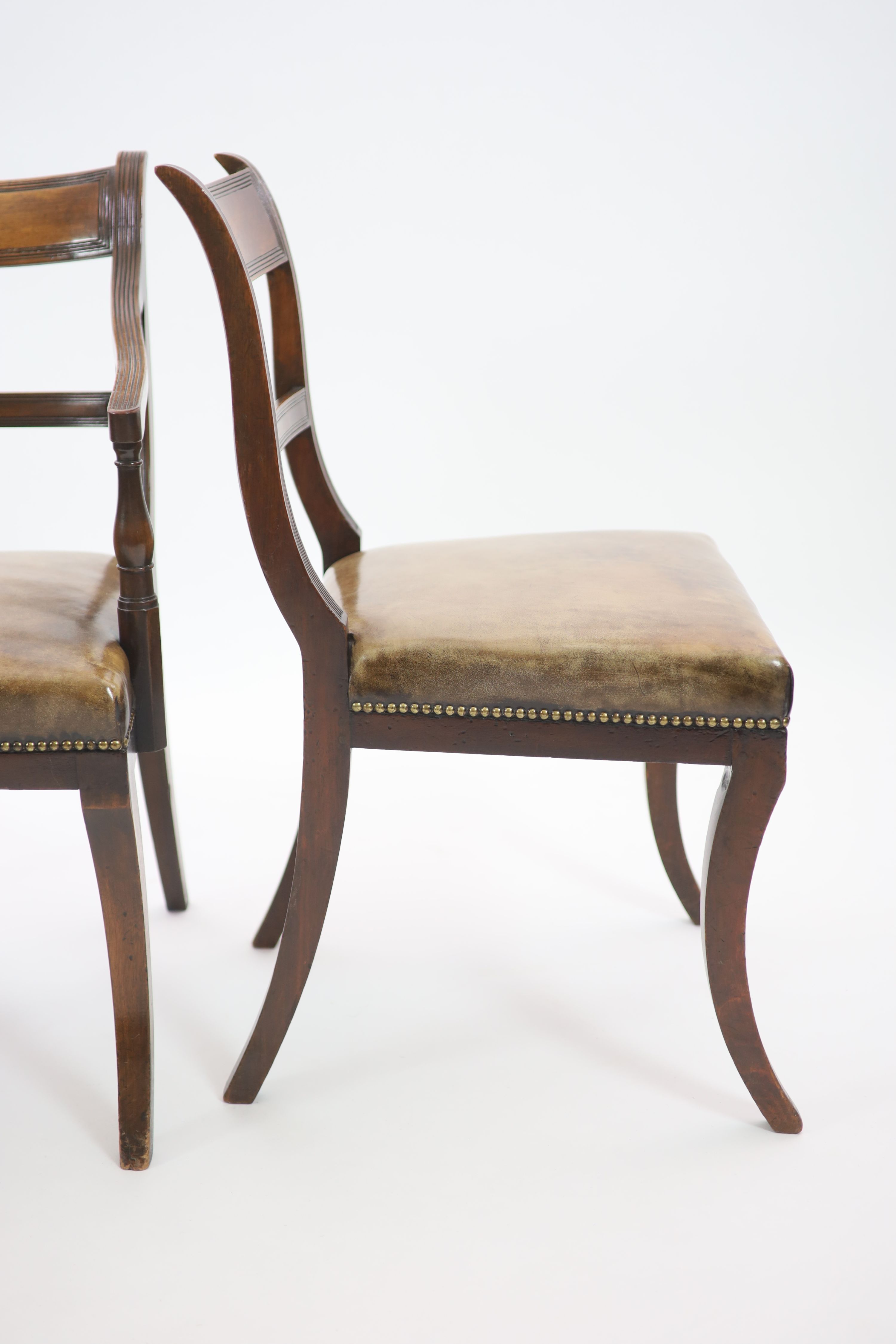 A set of fourteen Regency and later mahogany dining chairs, including two carvers, carvers W.58cm H.89cm